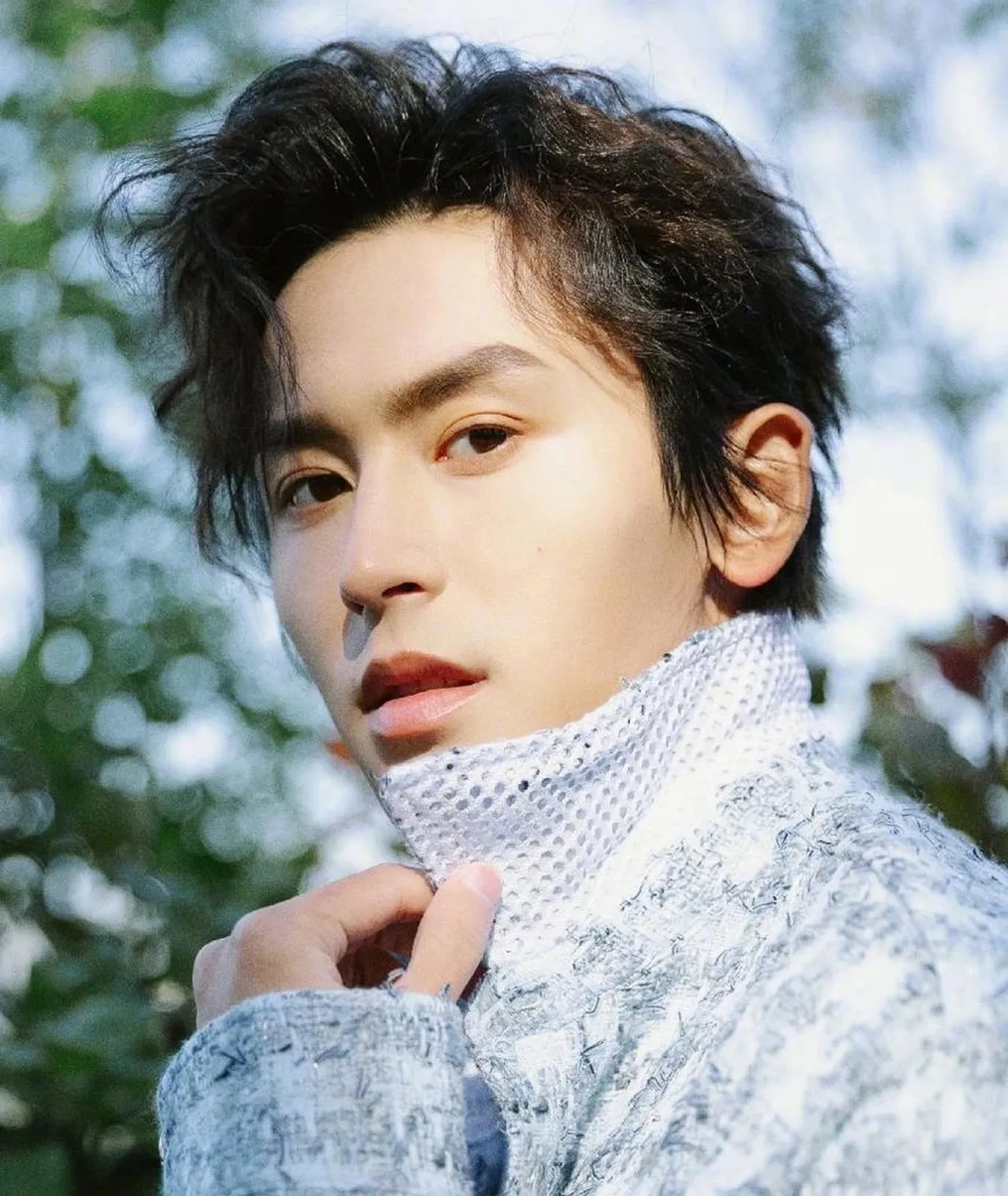 Asian male with long styled hair